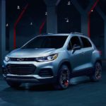 A silver 2020 Chevy Trax is parked in an empty warehouse.