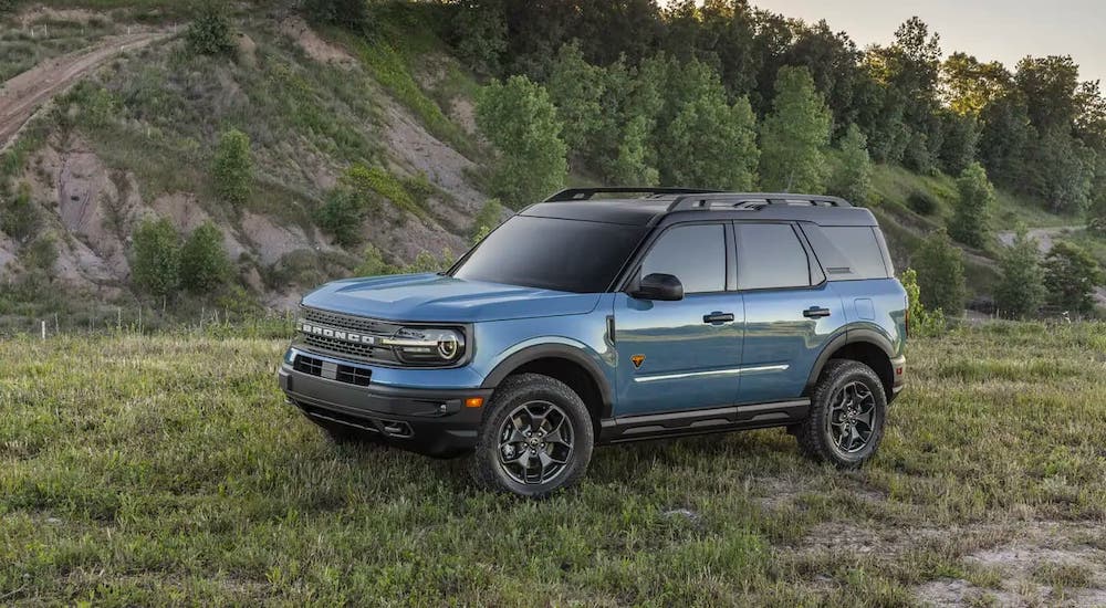 A blue 2021 Ford Bronco Sport is parked in the mountains.