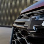 A closeup shows the blacked out Chevrolet logo on a 2022 Chevy Equinox.