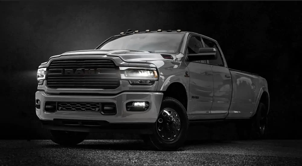 A silver 2020 Ram 3500 Night Package is parked on the pavement after leaving the Ram dealer.