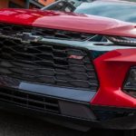 A close up of the front end on a red 2021 Chevy Blazer RS is shown.