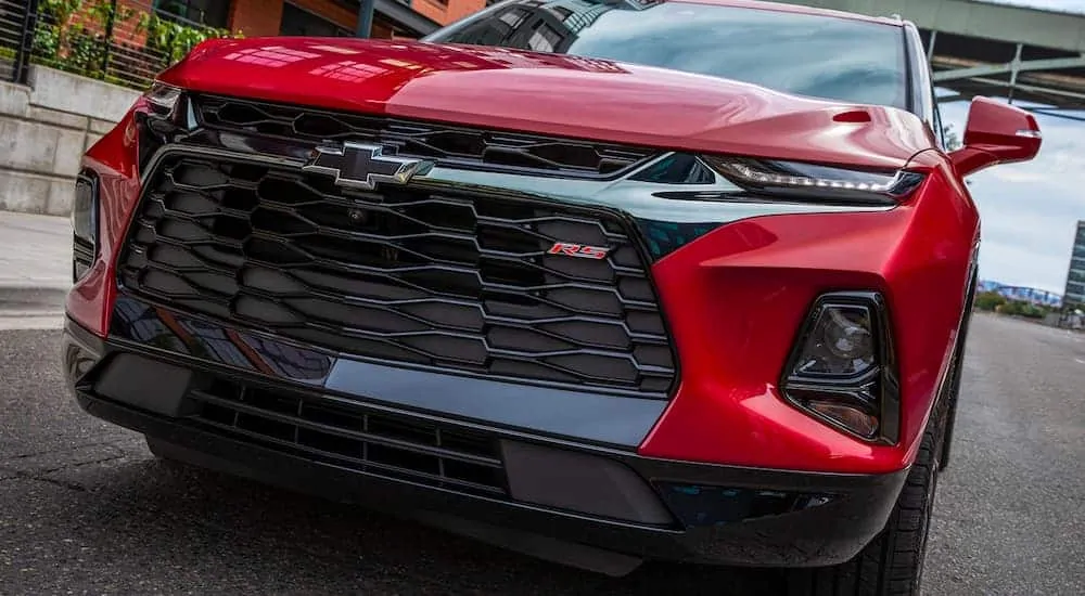 A close up of the front end on a red 2021 Chevy Blazer RS is shown.