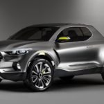 A silver 2021 Hyundai Santa Cruz is shown from the front angled left.