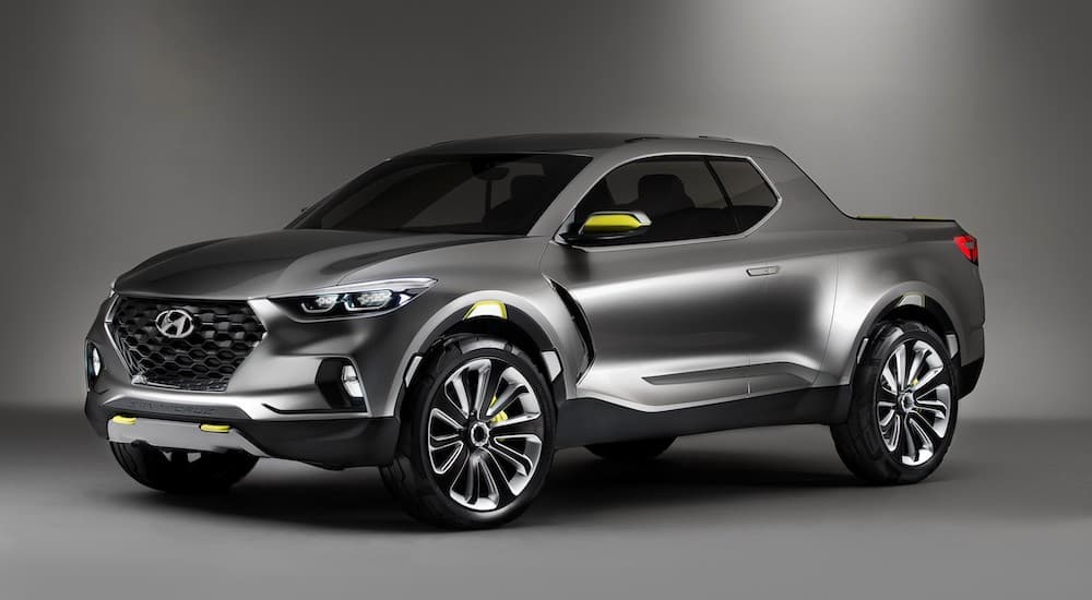 A silver 2021 Hyundai Santa Cruz is shown from the front angled left.