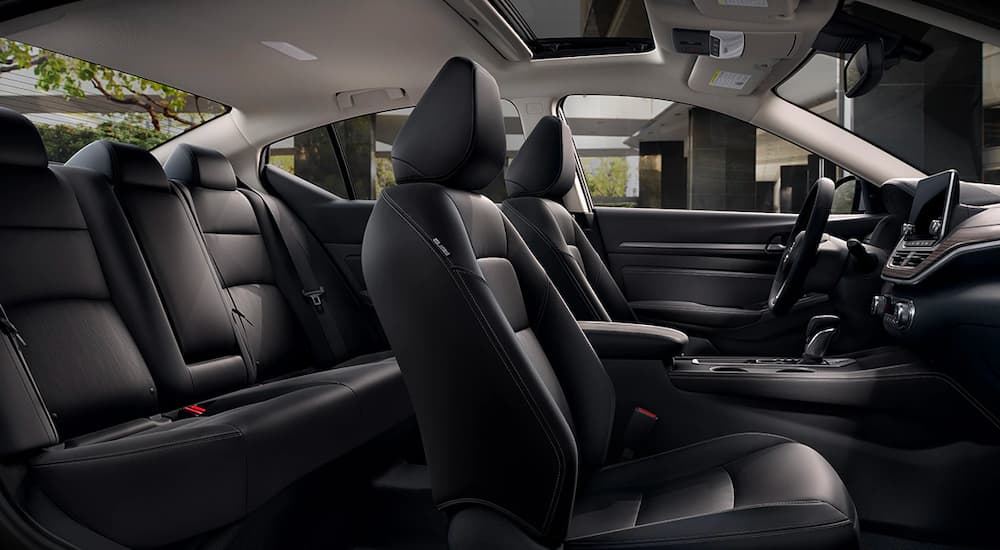 The black interior is shown from the passenger side on a 2021 Nissan Altima.