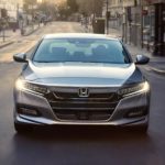 A silver 2020 Honda Accord from a Certified Honda dealer near me is shown from the front on a city street.