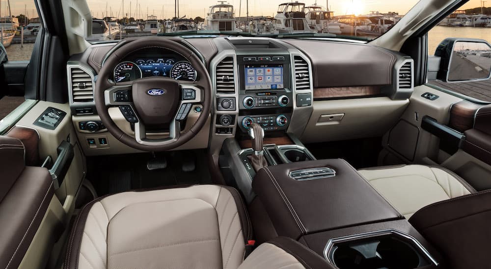 The black and white interior fo a 2019 Ford F-150 is shown.