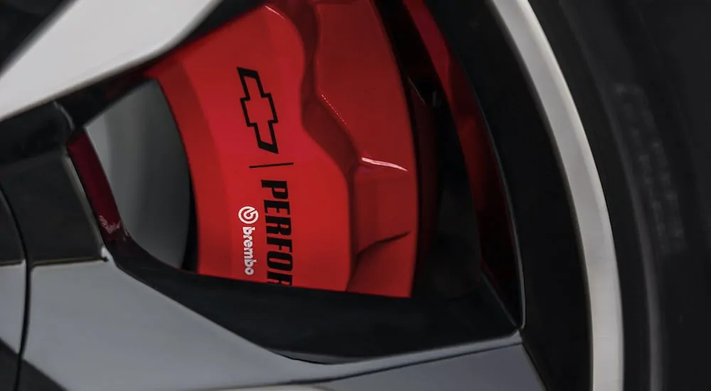 The red performance Brembo brakes are show in close up on a 2018 used Chevy Tahoe RST.