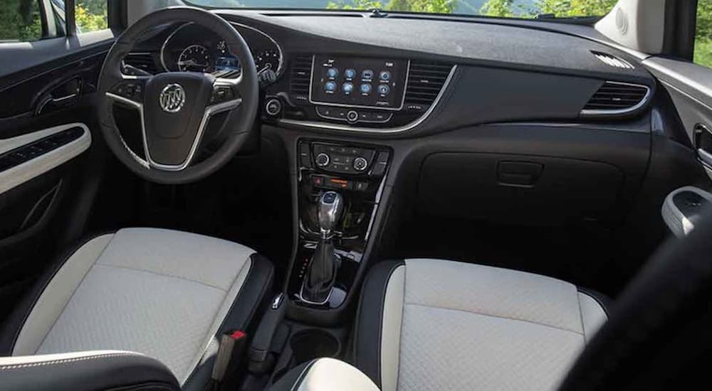 The white and black interior is shown in a 2021 Buick Encore.