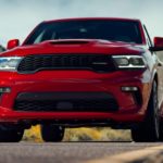 A red 2021 Dodge Durango is shown from the front on a rural road.