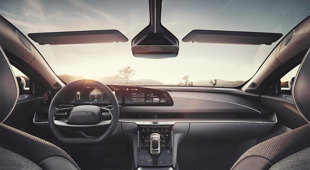 The interior of a Lucid Air is shown from the back seat.