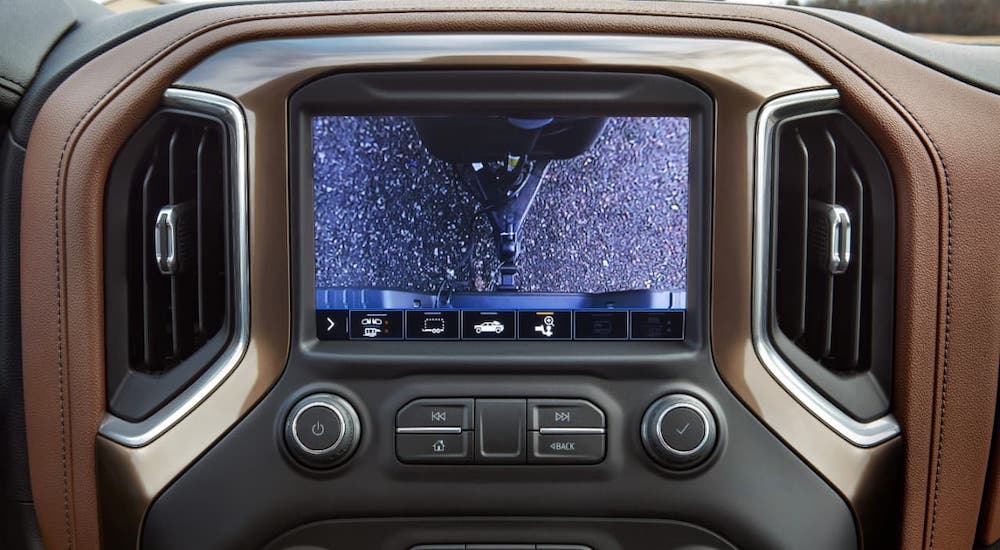 A closeup shows the backup camera in a 2021 Chevy Silverado HD and shows the trailer hitch.