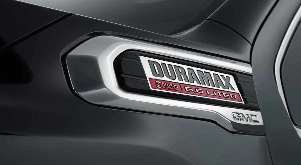 The Duramax badge on a black 2021 Chevy 3500 Chassis Cab is shown.