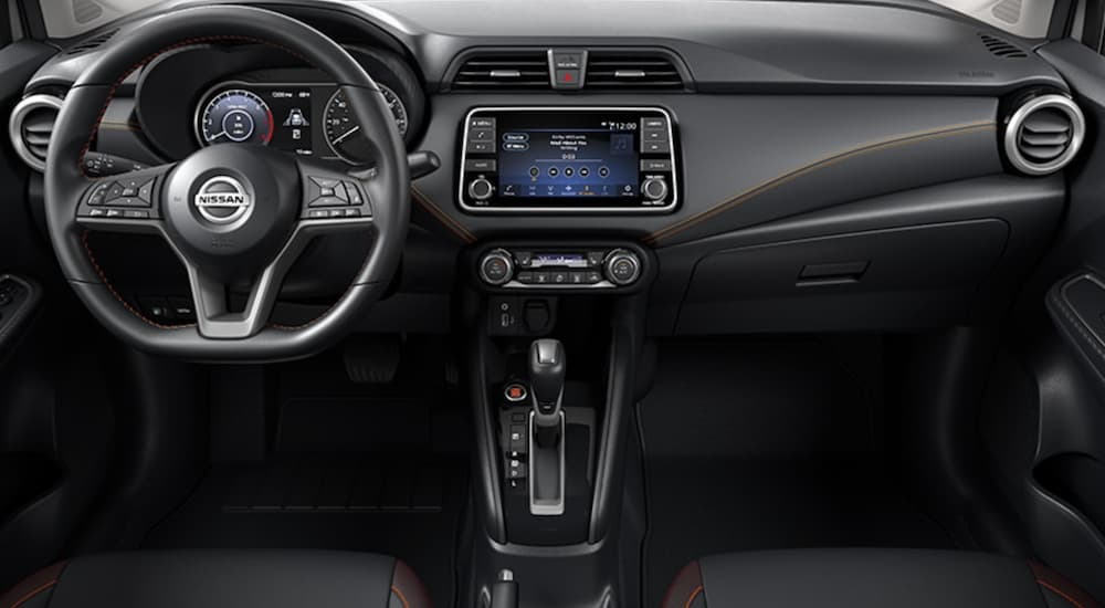 The black interior of a 2021 Nissan Versa is shown.