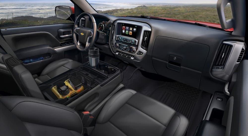 The black interior of a 2015 Chevy Silverado is shown.