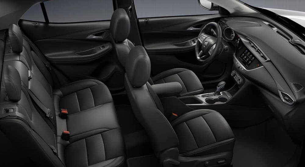 The two black rows of seats in a 2021 Buick Encore GX are shown from a high angle.