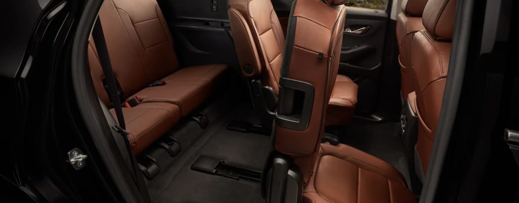 The brown interior seating is shown from the passenger side of a 2021 Chevy Traverse.