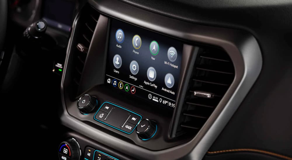 A close up shows the infotainment screen and apps in a 2021 GMC Acadia.