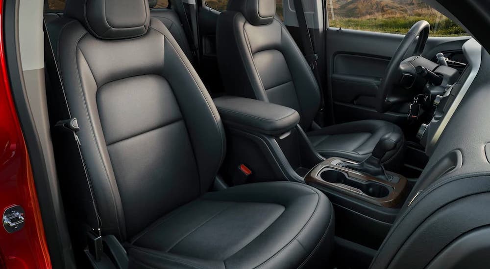 The black leather front seats are shown in a 2021 GMC Canyon.