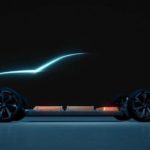 The silhouette of a Chevy EV is shown, these vehicles soon to be coming to a Chevy Dealer Near you.