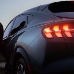 A close up shows a gray 2021 Ford Mustang Mach-E from behind after leaving a Ford dealer in Louisville.
