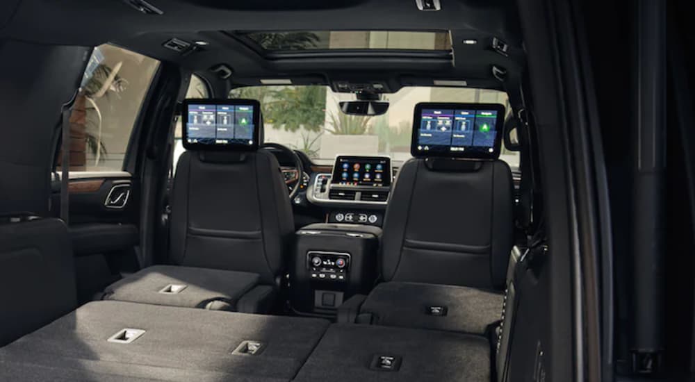 The interior of a 2021 Chevy Suburban is shown from the back. 