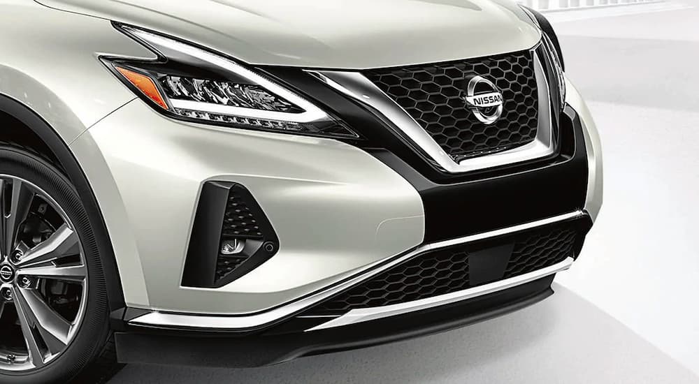 A close up shows the front end of a white 2021 Nissan Murano.