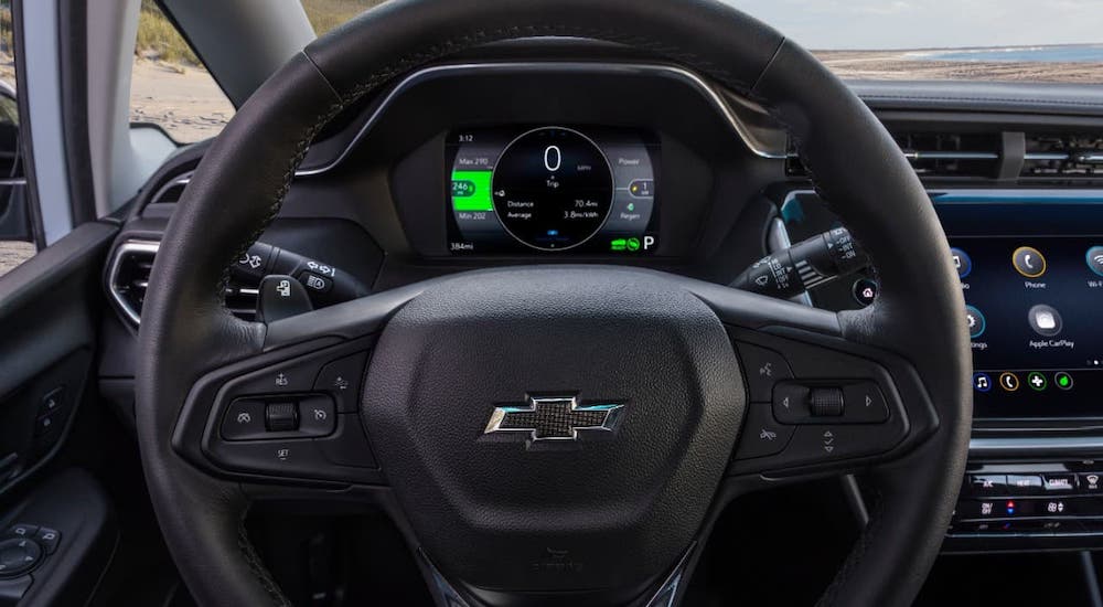 A closeup shows the steering wheel and information cluster in a 2022 Chevy Bolt EV.