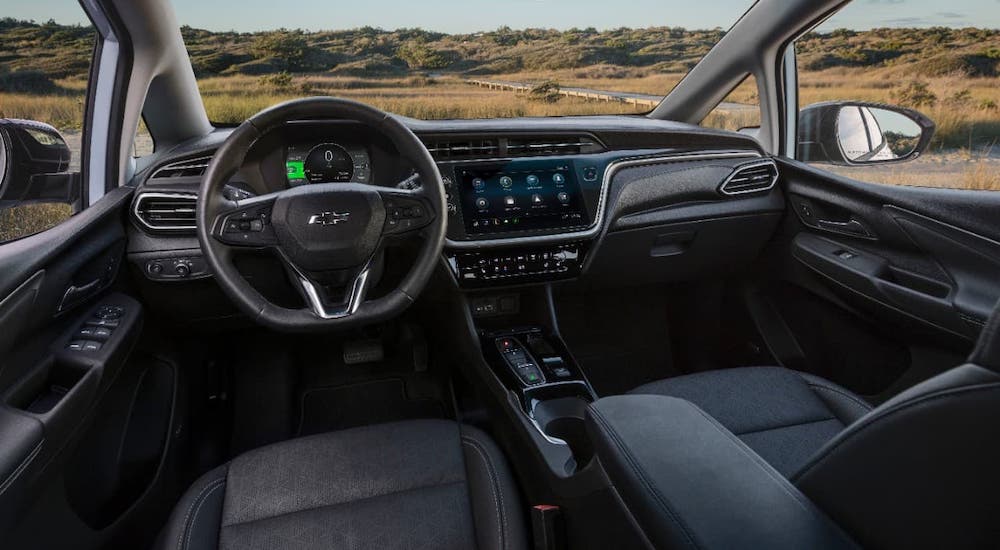 The black interior of a 2022 Chevy Bolt EV is shown.