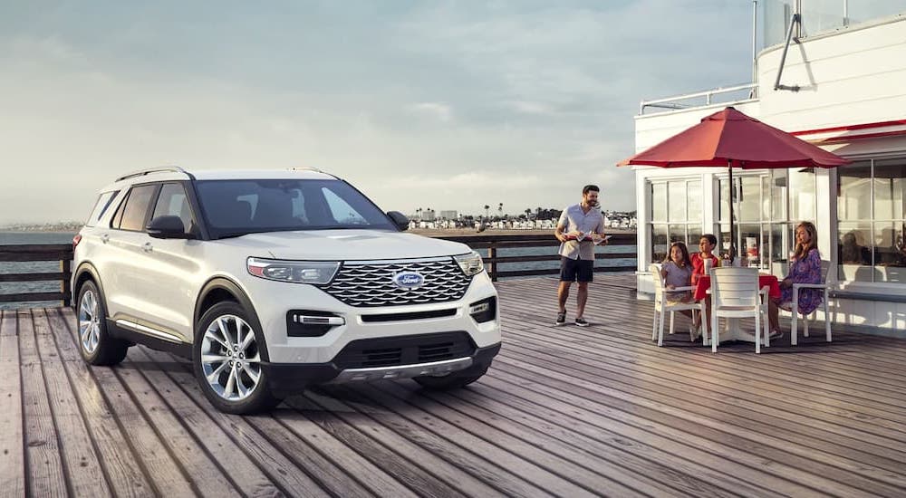 A white 2021 Ford Explorer is parked on a pier after leaving a Cincinnati Ford Explorer dealer.