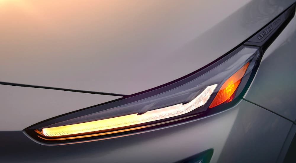 A close up shows the driver side headlight on a silver 2022 Chevy Bolt EUV.