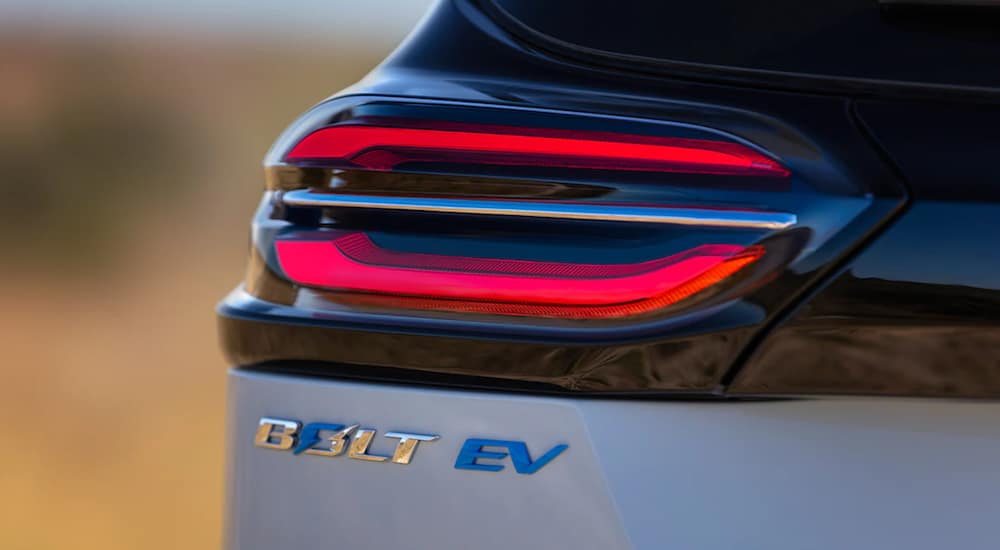 A 2022 Chevy Bolt EV rear emblem is shown.