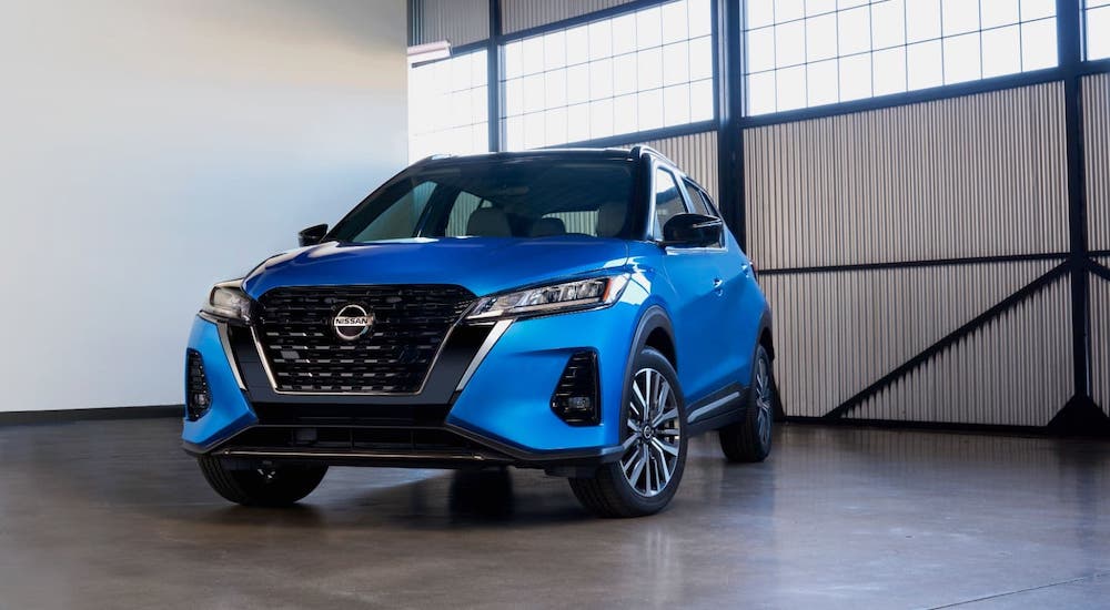 A popular Nissan lease deal, a 2021 Nissan Kicks, is parked in a warehouse.
