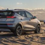 A silver 2022 Chevy Bolt EUV is parked on the beach after leaving a Chevy Dealer near you.