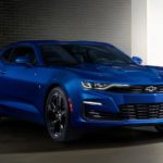 A blue 2021 Chevy Camaro is parked in a garage after leaving a used Chevy dealer.