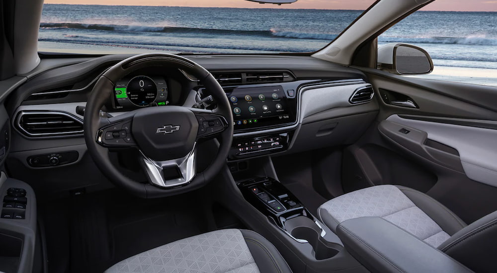 The interior of a 2022 Chevy Bolt EUV shows the steering wheel and infotainment screen.