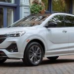 A white 2021 Buick Encore GX is parked outside of a shop after winning a 2021 Buick Encore GX vs 2021 Volvo XC40 comparison.