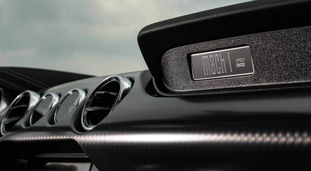 The interior of a 2021 Ford Mustang Mach 1 shows a Mach 1 emblem.