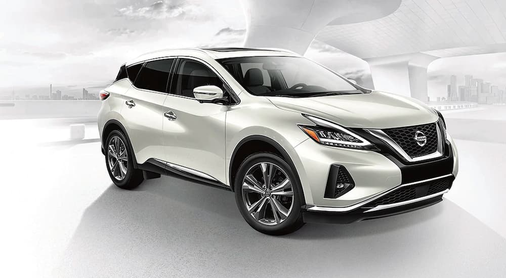 A white 2021 Nissan Murano is shown against a faded background.