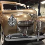 A bronze 1940 Desoto is shown from the front.