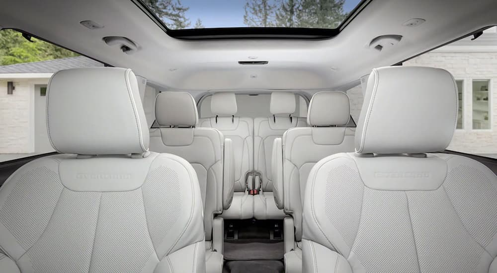 The interior of a 2021 Jeep Grand Cherokee L shows three rows of seating.