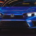 A blue 2022 Honda Civic Sport is shown from the front after leaving a 2022 Honda Civic Dealer.