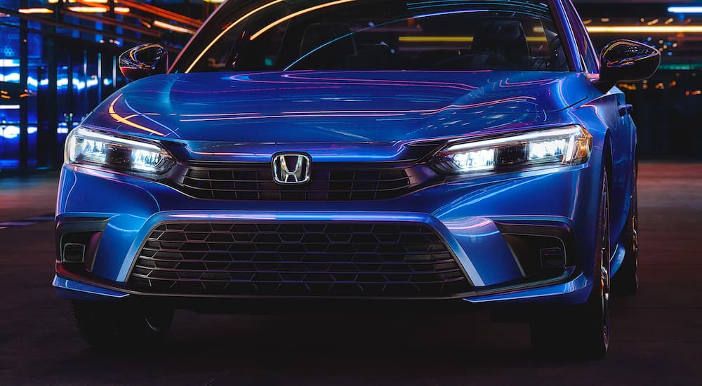 A blue 2022 Honda Civic Sport is shown from the front after leaving a 2022 Honda Civic Dealer.