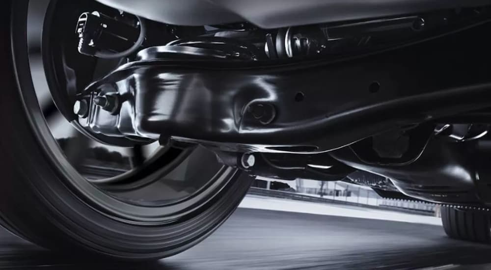 The rear suspension is shown from a low angle on a 2022 Volkswagen Golf GTI Autobahn Edition.