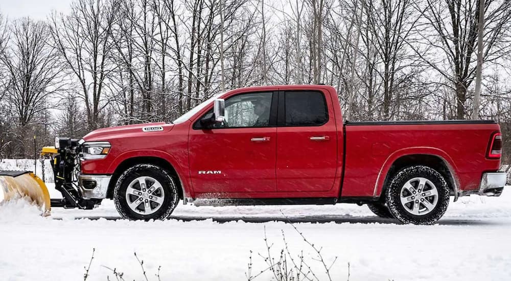 A red 2021 Ram 1500 is shown plowing after winning a 2021 Ram 1500 vs 2021 Ford F-150 comparison.