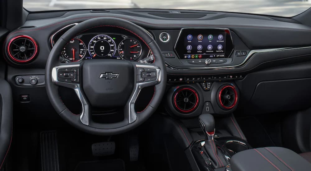 The interior of a 2022 Chevy Blazer RS shows the steering wheel and infotainment screen.