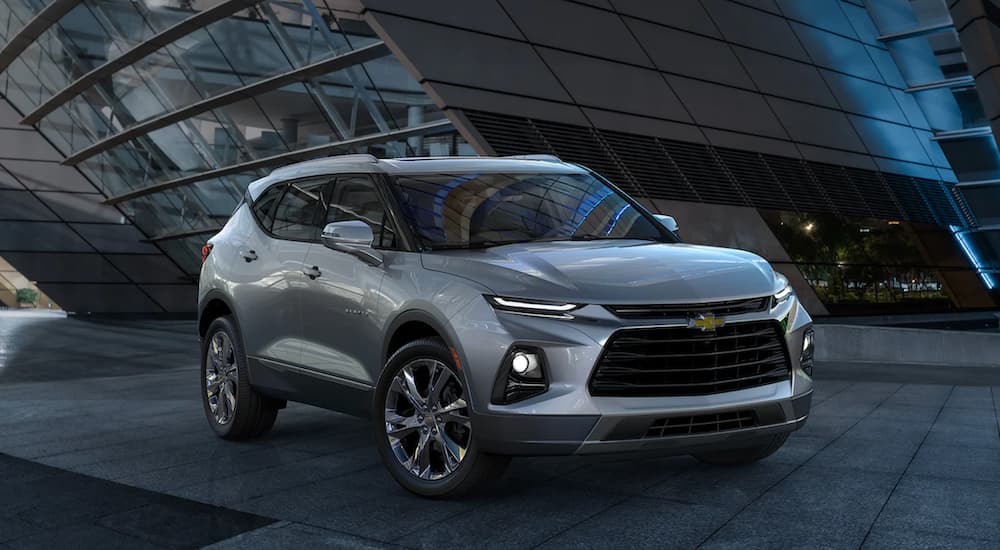 A silver 2022 Chevy Blazer is shown from an angle parked in a modern lot.