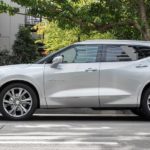 A white 2022 Chevy Blazer is shown form the side parked in a city.