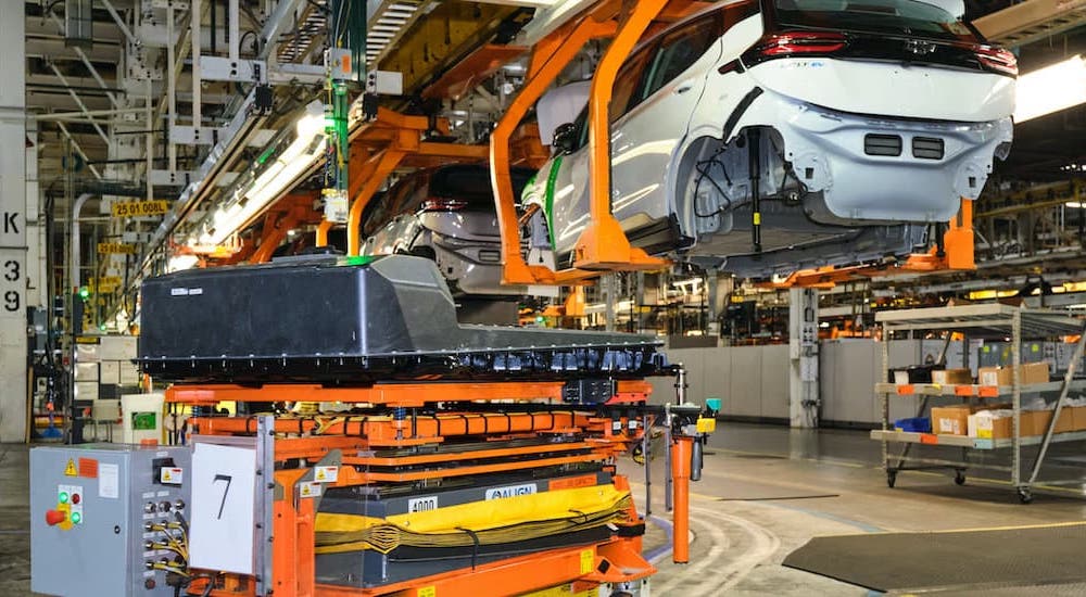2022 Chevy Bolt EV and EUV vehicles are shown being assembled in a plant.