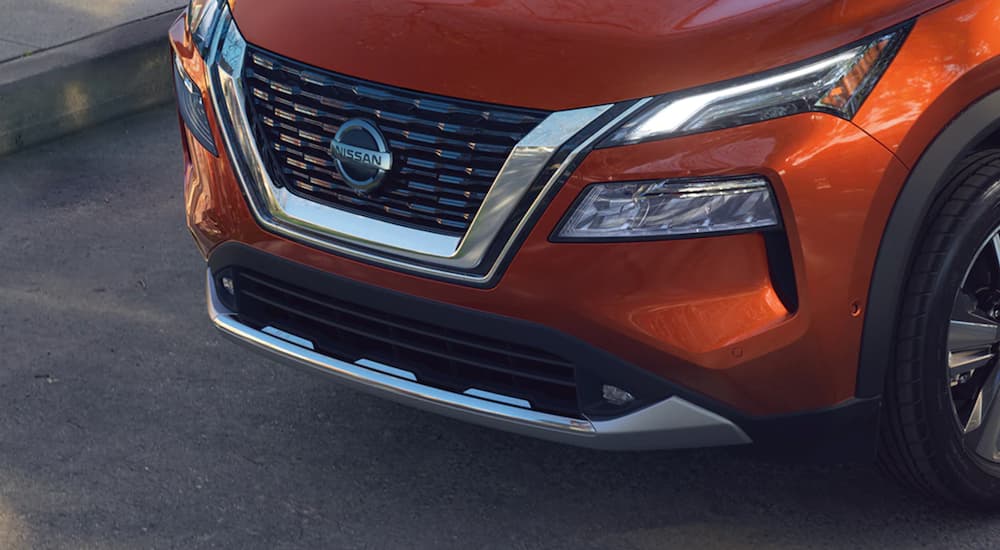 A close up shows the grille of a 2021 Nissan Rogue.